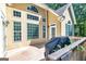 Back of house featuring an expansive deck, many windows, and an outdoor grill at 235 Ashley Forest Dr, Fayetteville, GA 30214