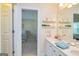 Bathroom featuring a double sink vanity, and a view to bedroom at 235 Ashley Forest Dr, Fayetteville, GA 30214
