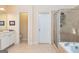 Large primary bathroom with a soaking tub, tiled walk-in shower, and vanity at 235 Ashley Forest Dr, Fayetteville, GA 30214