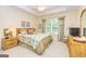 Bright bedroom with natural light, ceiling fan, and elegant decor at 235 Ashley Forest Dr, Fayetteville, GA 30214