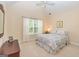 Comfortable bedroom with vaulted ceiling, window with blinds, and neutral carpeting at 235 Ashley Forest Dr, Fayetteville, GA 30214