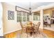 Charming dining room with natural light, hardwood floors and decorative lighting at 235 Ashley Forest Dr, Fayetteville, GA 30214