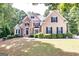 Stunning two-story home with stone accents, mature landscaping, and classic design at 235 Ashley Forest Dr, Fayetteville, GA 30214