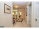 Upstairs hallway with carpeting, access to bedrooms, and view of the first floor at 235 Ashley Forest Dr, Fayetteville, GA 30214