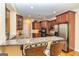 Granite countertops and stainless steel appliances featured in this stylish kitchen with breakfast bar seating at 235 Ashley Forest Dr, Fayetteville, GA 30214