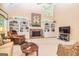Cozy living room featuring stone fireplace, built-in shelving, and comfortable seating at 235 Ashley Forest Dr, Fayetteville, GA 30214