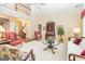 Open-concept living room with high ceilings, traditional decor, and comfortable seating at 235 Ashley Forest Dr, Fayetteville, GA 30214