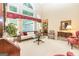 Spacious living room with large windows, plush seating, and bright natural light at 235 Ashley Forest Dr, Fayetteville, GA 30214