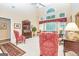 Bright living room with high ceilings, large windows, and traditional furniture at 235 Ashley Forest Dr, Fayetteville, GA 30214