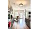 Bright eat-in kitchen featuring grey cabinets, stainless appliances, wood floors, and modern lighting at 413 Atlas Ct, Locust Grove, GA 30248