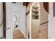 Walk-in closet with a view to the bedroom, with built-in shelving and plenty of storage at 612 Champions Dr, Mcdonough, GA 30253