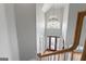 Grand foyer with a chandelier, hardwood floors, and a staircase leading to the upper level at 612 Champions Dr, Mcdonough, GA 30253