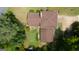 Aerial view of home showing the roof and layout, surrounded by lush greenery and a well-maintained lawn at 6214 Crestview Se Dr, Covington, GA 30014