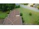 Aerial view of a home with a brick chimney, surrounded by lush greenery and mature trees at 6214 Crestview Se Dr, Covington, GA 30014