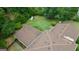 Aerial view of a house, featuring a lush green yard, mature trees and surroundings, creating a private retreat at 6214 Crestview Se Dr, Covington, GA 30014