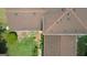 A bird's eye view of a home with a well-maintained roof, patio, and lush greenery in the yard at 6214 Crestview Se Dr, Covington, GA 30014