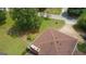 An aerial view of a home with a lush green lawn, surrounded by mature trees in a neighborhood at 6214 Crestview Se Dr, Covington, GA 30014