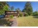 Well-maintained two-story home with mature trees, brick accents and a large front yard in a quiet neighborhood at 6214 Crestview Se Dr, Covington, GA 30014