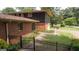 A well-maintained home featuring a brick exterior and mature trees lining the front yard at 6214 Crestview Se Dr, Covington, GA 30014