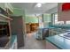 Kitchen featuring stainless steel appliances and uniquely colored cabinets at 6214 Crestview Se Dr, Covington, GA 30014