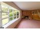 Living room with large picture window and brick fireplace feature at 6214 Crestview Se Dr, Covington, GA 30014