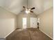 Spacious bedroom with carpet, ceiling fan, neutral paint, and closets at 9124 Comstock Ct, Covington, GA 30014