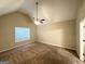 Spacious bedroom with carpet, ceiling fan, neutral paint, and a window at 9124 Comstock Ct, Covington, GA 30014