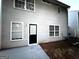 Home's exterior featuring a backyard patio, siding, and several windows at 408 Kendall Ln, Mcdonough, GA 30253