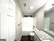 Bathroom featuring a granite vanity top, white cabinets, and a shower-tub combo at 408 Kendall Ln, Mcdonough, GA 30253