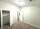 Bedroom featuring a closet with double doors and an open doorway to another room at 408 Kendall Ln, Mcdonough, GA 30253