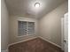 Bedroom features neutral walls, carpeting, a window with blinds and white door at 408 Kendall Ln, Mcdonough, GA 30253