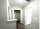 Hallway with laminate flooring and a large storage closet at 408 Kendall Ln, Mcdonough, GA 30253