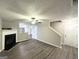 Inviting living room with a cozy fireplace, neutral paint, and modern laminate flooring at 408 Kendall Ln, Mcdonough, GA 30253
