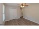 Bedroom with wood-look floors, closet, and views of the backyard at 525 Baker Nw Cir, Atlanta, GA 30318