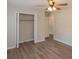 Bedroom features wood-look flooring and closet with shelving at 525 Baker Nw Cir, Atlanta, GA 30318