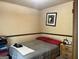Modest bedroom provides a comfortable space with neutral tones and wall art at 8636 Woodside Ln, Jonesboro, GA 30238