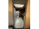 Compact kitchen showing appliances, cabinets, and tiled flooring at 8636 Woodside Ln, Jonesboro, GA 30238