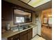 Cozy kitchen with a window to the backyard, offering a practical cooking space at 8636 Woodside Ln, Jonesboro, GA 30238