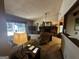 Comfortable living room features a brick fireplace and plenty of natural light at 8636 Woodside Ln, Jonesboro, GA 30238