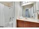 A clean bathroom features a shower with a curtain, a vanity with a mirror, and tile floors at 3641 Ridge Towne Dr, Duluth, GA 30096