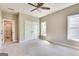 Comfortable bedroom with a ceiling fan, spacious closet, and an ensuite bathroom with a tub and shower at 3641 Ridge Towne Dr, Duluth, GA 30096