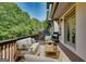 Outdoor wooden deck with comfortable seating and grill, ideal for relaxation at 3641 Ridge Towne Dr, Duluth, GA 30096