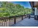 Wooden deck surrounded by mature trees, offering ample space for outdoor seating at 3641 Ridge Towne Dr, Duluth, GA 30096