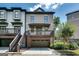 Well-maintained townhome with private garage, cozy porch, and beautiful landscaping enhancing its curb appeal at 3641 Ridge Towne Dr, Duluth, GA 30096