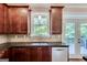 Close up of modern kitchen with stainless steel appliances and view to the outside at 3641 Ridge Towne Dr, Duluth, GA 30096
