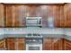 Kitchen details with stainless steel appliances and dark wood cabinets at 3641 Ridge Towne Dr, Duluth, GA 30096
