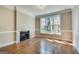 Comfortable living room with hardwood floors, fireplace, and large window at 3641 Ridge Towne Dr, Duluth, GA 30096