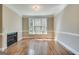 Cozy living room featuring hardwood floors and a fireplace at 3641 Ridge Towne Dr, Duluth, GA 30096