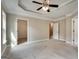 Spacious main bedroom with carpeted floors, and a door to the walk-in closet and ensuite bathroom at 3641 Ridge Towne Dr, Duluth, GA 30096