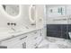 Elegant bathroom with marble floors, double vanity, and sleek black fixtures at 115 Thome, Alpharetta, GA 30022